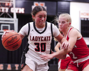 Lady Cats overcome adversity to claim victory over visiting Red Raiders, 45-32