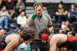 NU alumnus returns to the mat as a wrestling official