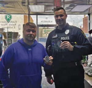 Local business donates police badge stickers